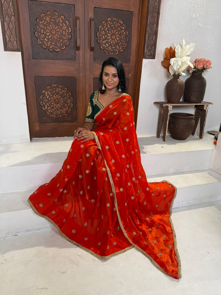 Orange saree with Green Stitched Blouse